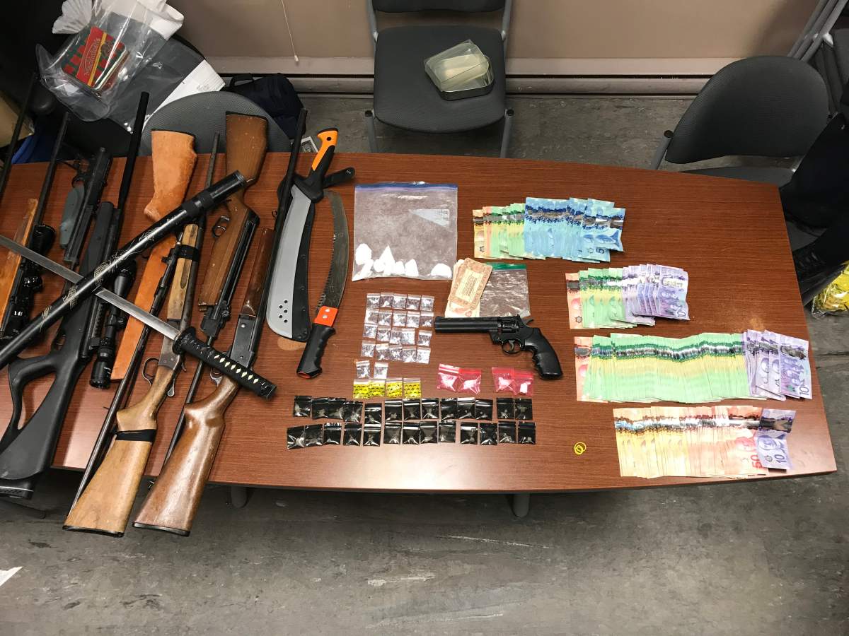 RCMP seize drugs, weapons and cash from a home in Crane River, Man. Charges are pending for three people. 