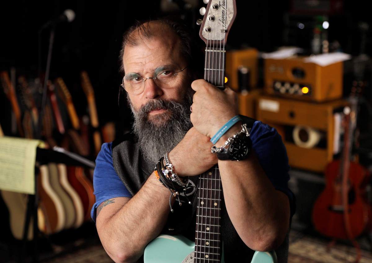 In this June 8, 2017, photo, Grammy-winning songwriter Steve Earle poses in a rehearsal studio in Nashville, Tenn.