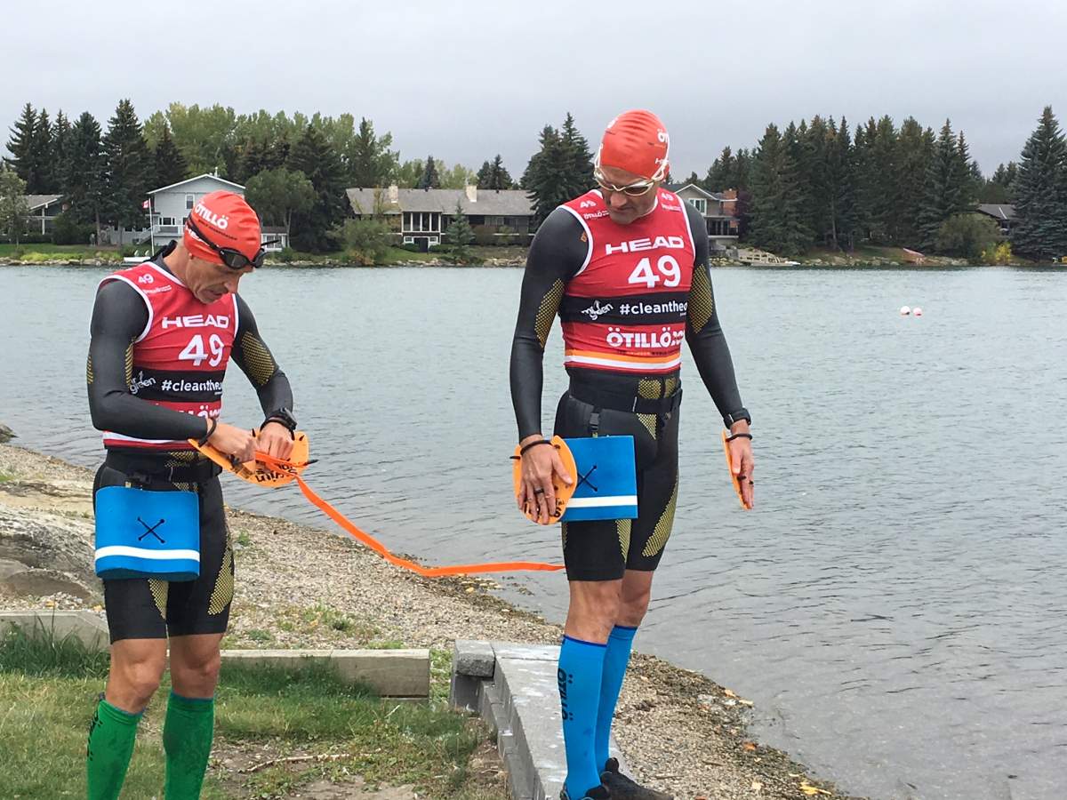 Calvin Zaryski and Myron Tetreault train at Lake Bonavista in Calgary for a swimrun. Sept. 12, 2018.