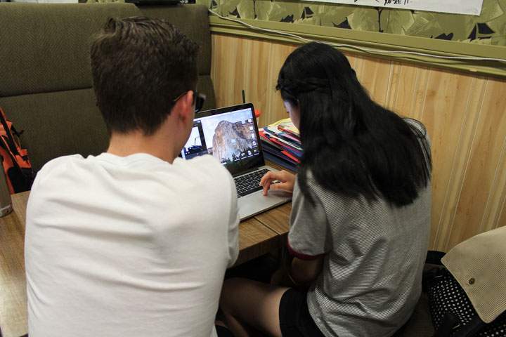 Silas Young and Wendy Wang at work on their video on addiction and substance abuse.