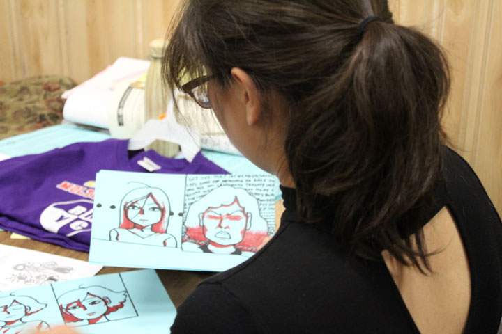 Tyarra Goodman works on the drawings for her video.