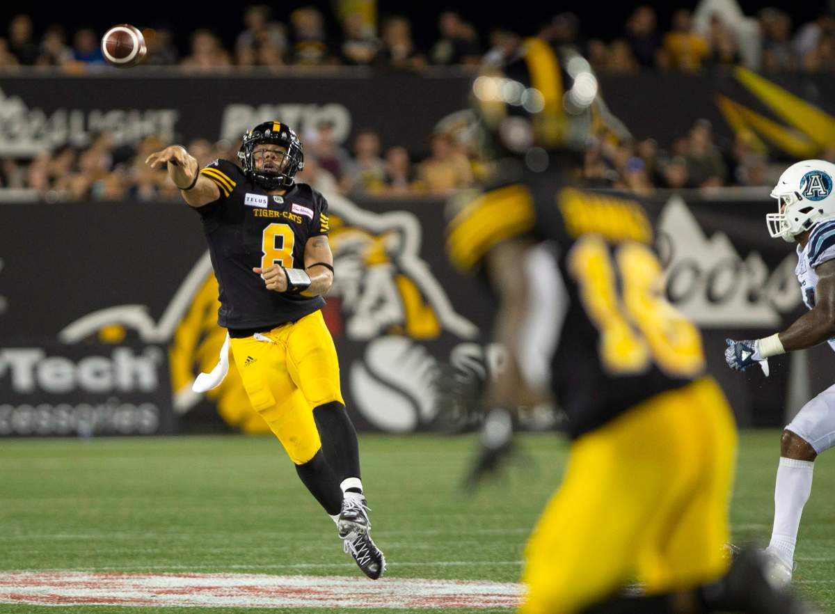 Hamilton Tiger-Cats quarterback Jeremiah Masoli (8) throws to Hamilton Tiger-Cats wide receiver Brandon Banks (16) during second half CFL football game action against the Toronto Argonauts in Hamilton, Ont. on Monday, September 3, 2018.