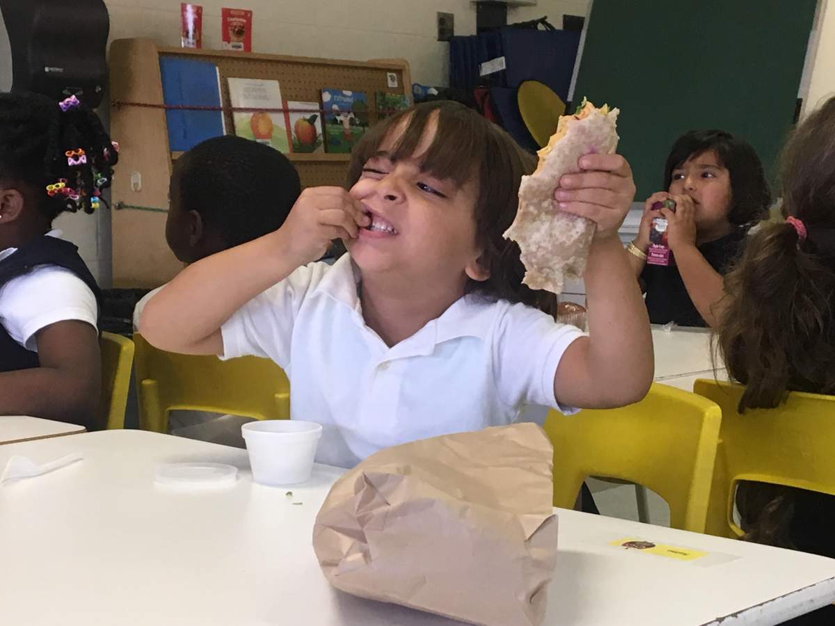 A young student enjoys his free lunch at Ecole Alice Parizeau in Ahuntsic Cartierville on Sept 20, 2018.