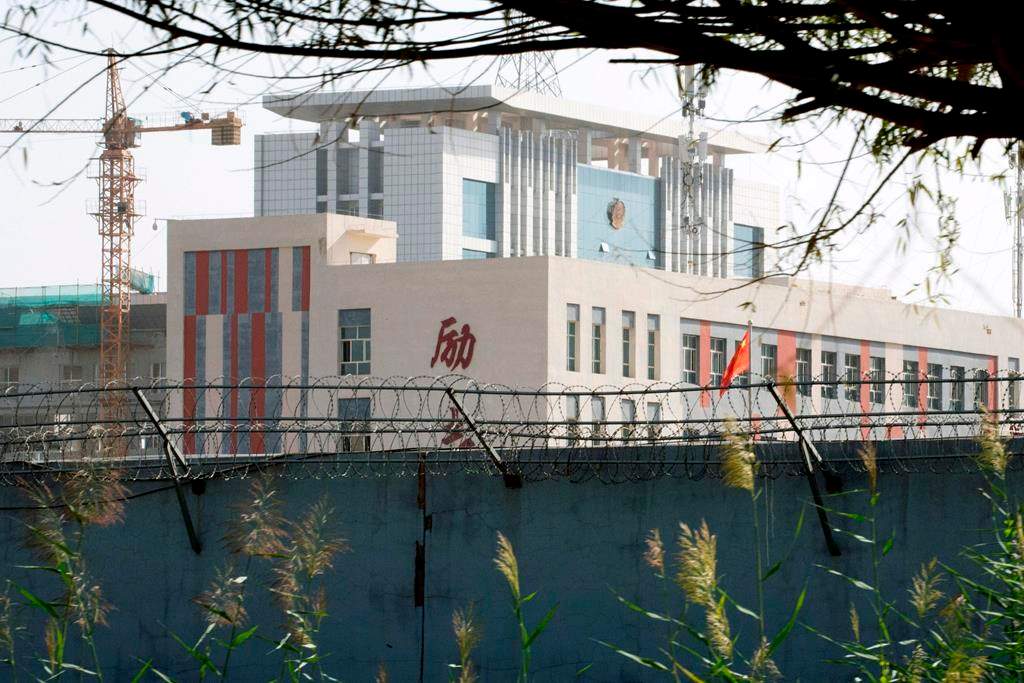 In this Aug. 31, 2018, photo, barbed wire protects the walls around a cluster of schools on the outskirts of Kashgar, in western China’s Xinjiang region. (AP Photo/Ng Han Guan)