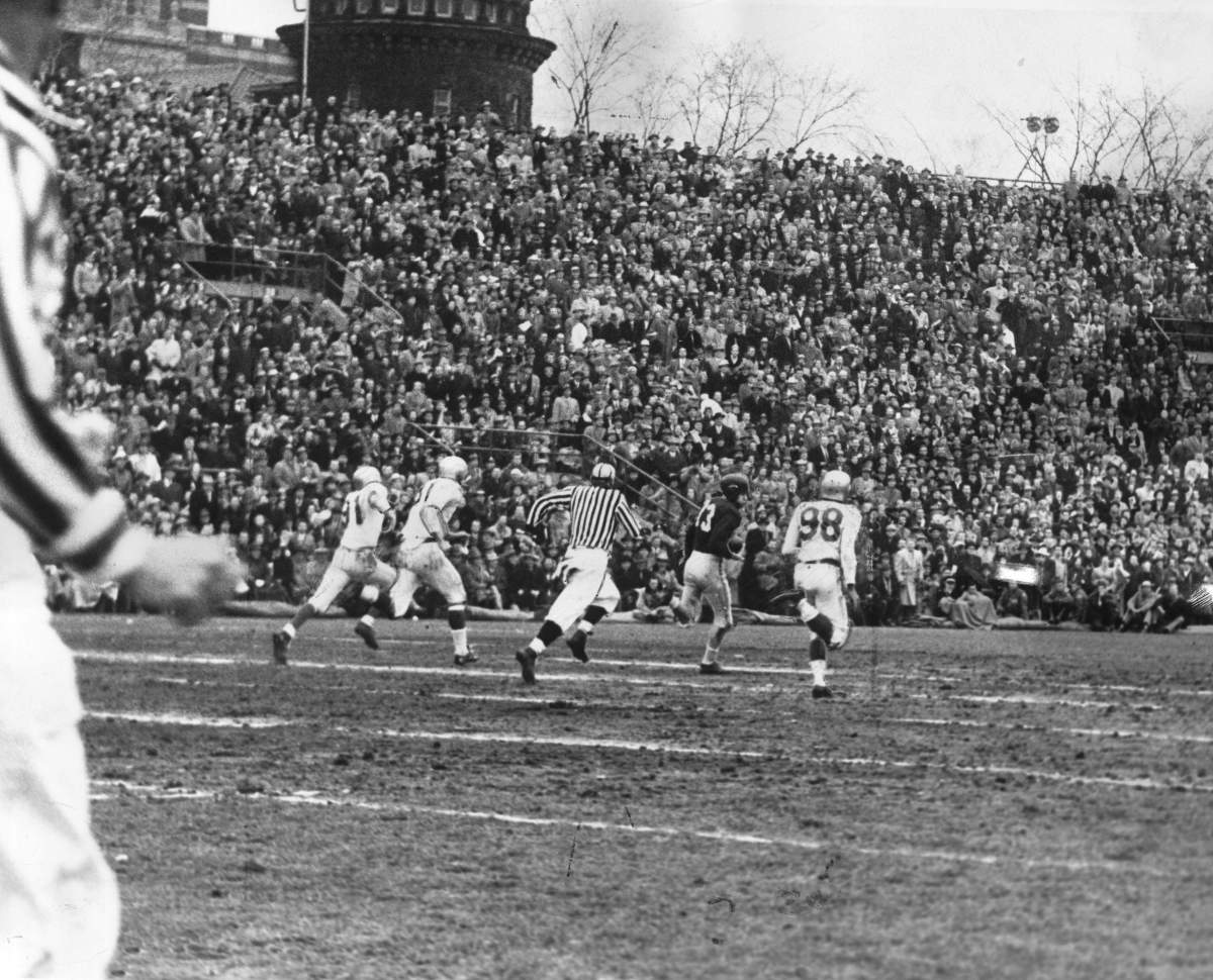 NOVEMBER 28, 1954 — ESKIMOS RALLY TO UPSET ALOUETTES, 26-25 IN GREY CUP ACTION — Montreal Alouettes’ end, Red O’Quinn (73), racing for first touchdown on the 90 yard play. The Edmonton Eskimos players Jackie Parker, Earl Lindley and Rollie Miles chase down the field after O’Quinn.Published on Nov. 29, 1954