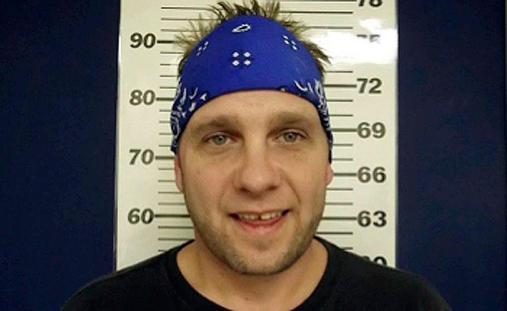 In this D’Iberville Police Department photo released on Wednesday, Feb. 19, 2014, 3 Doors Down bassist Todd Harrell poses for a photograph. 