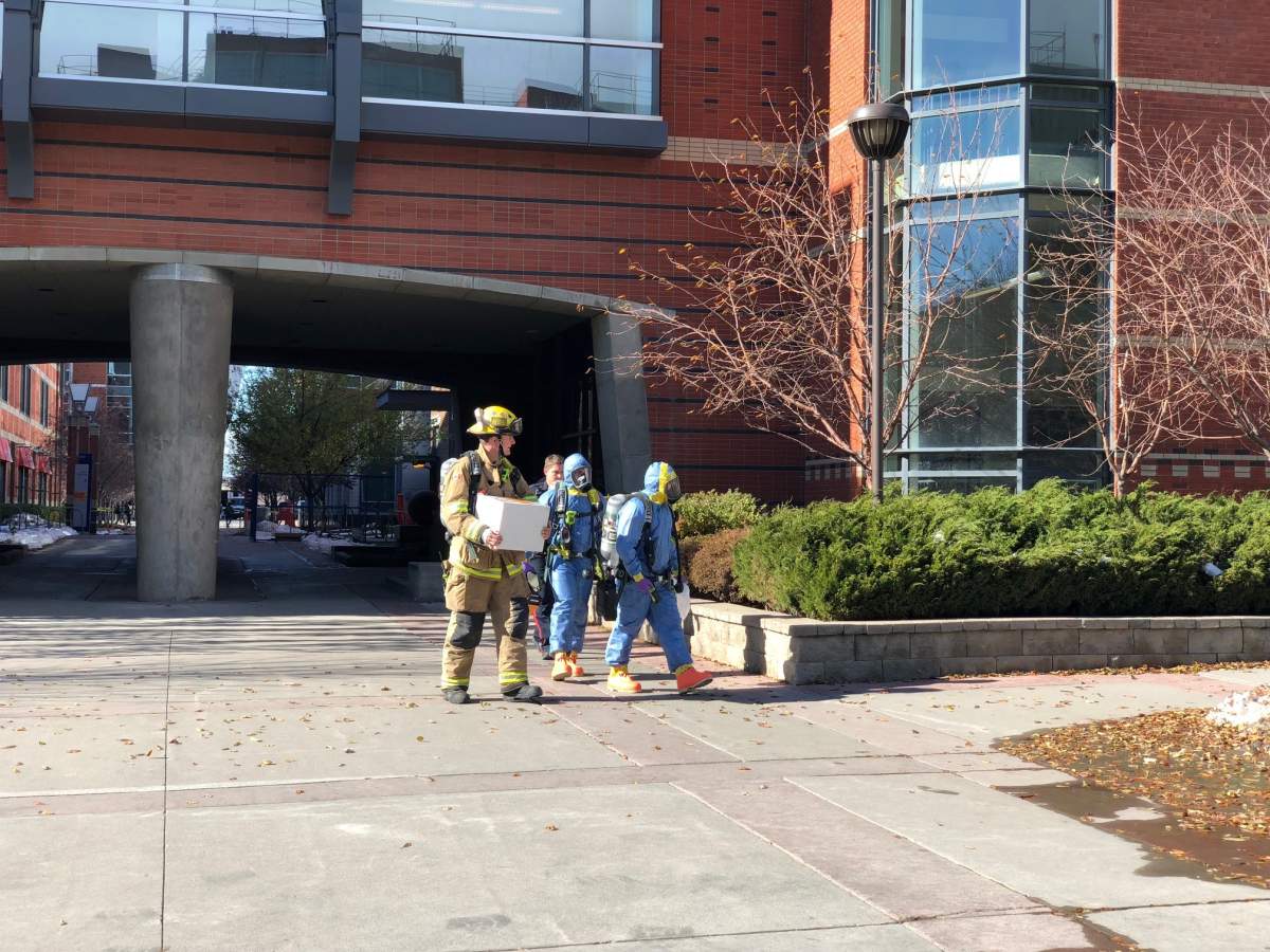 Firefighters and first responders in hazmat suits respond to SAIT on Friday, Oct. 12, 2018.