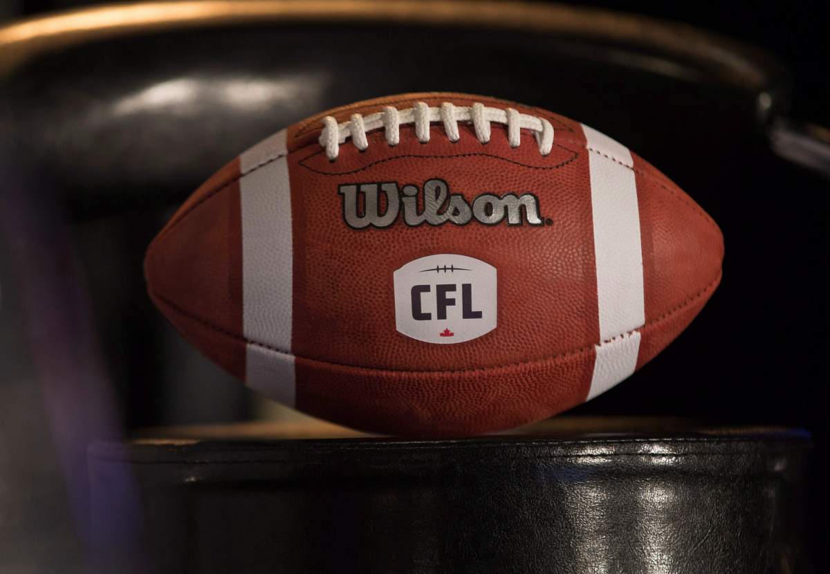 A football with the new CFL logo sits on a chair.