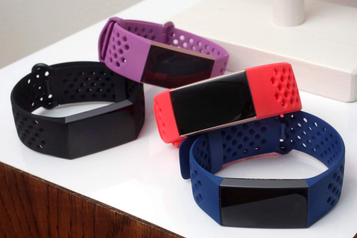 In this Aug. 16, 2018 file  photo, Fitbit Charge 3 fitness trackers with sport bands are displayed in New York. 