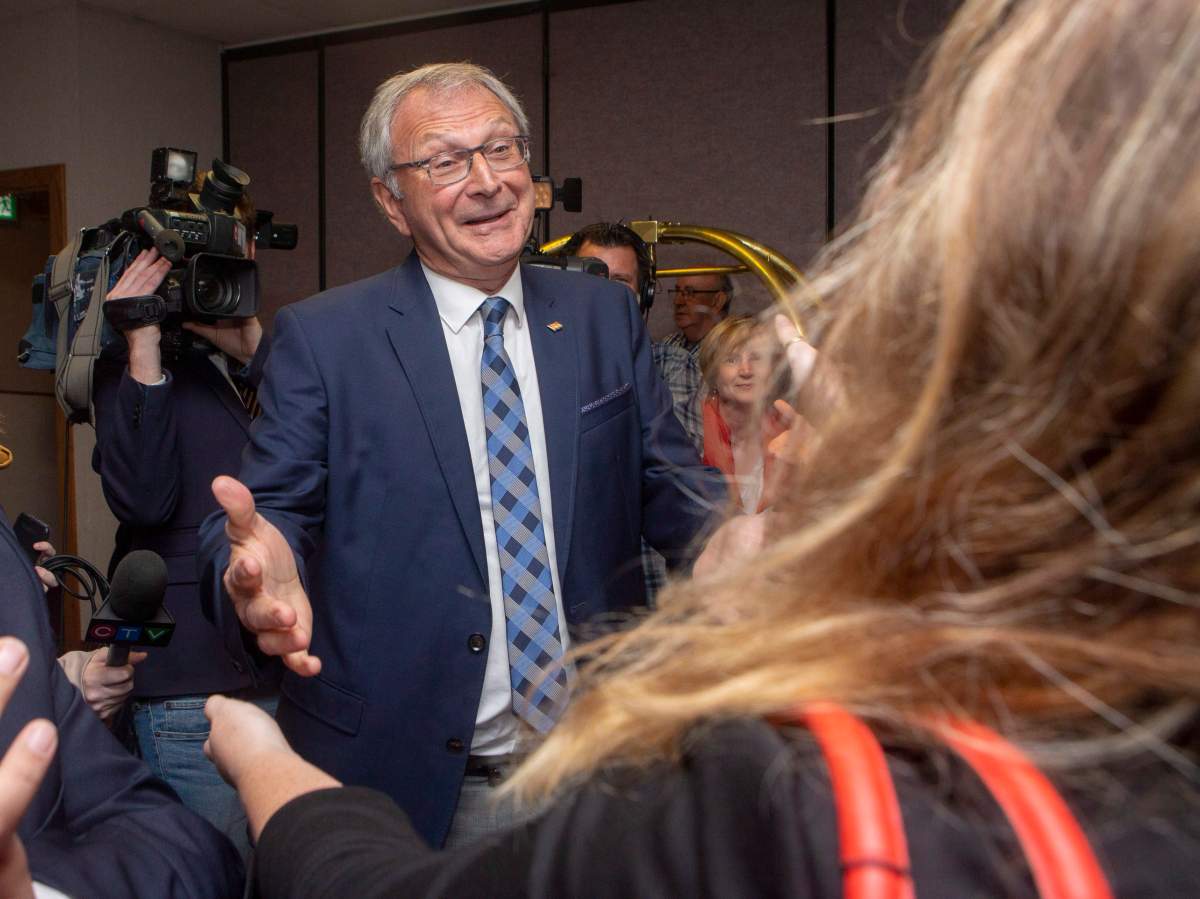 New Brunswick Progressive Conservative Leader Blaine Higgs is greeted by fellow Tories prior to a meeting of the candidates in Fredericton on Thursday, Sept. 27, 2018. 