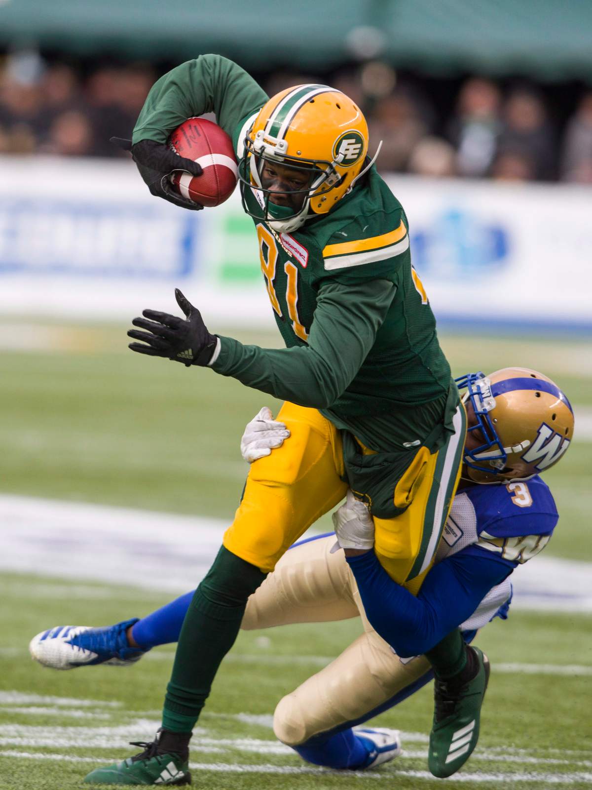 Winnipeg Blue Bombers’ Kevin Fogg (3) wraps up Edmonton Eskimos’ Dhaquille Williams during first half CFL action in Edmonton, Alta., on Saturday September 29, 2018.