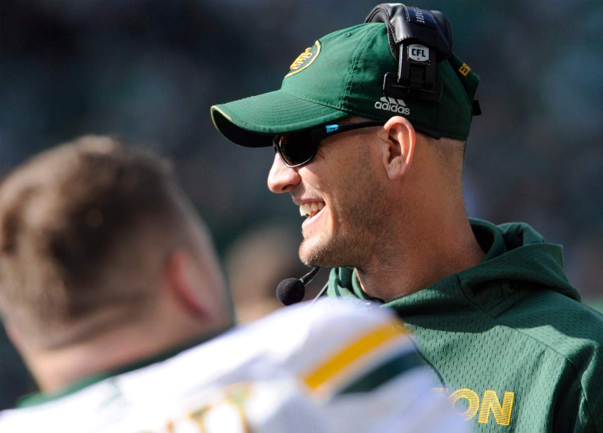 Edmonton Eskimos head coach Jason Maas chats on the sideline before first half CFL action against the Saskatchewan Roughriders, in Regina on Monday, Oct. 8, 2018. 