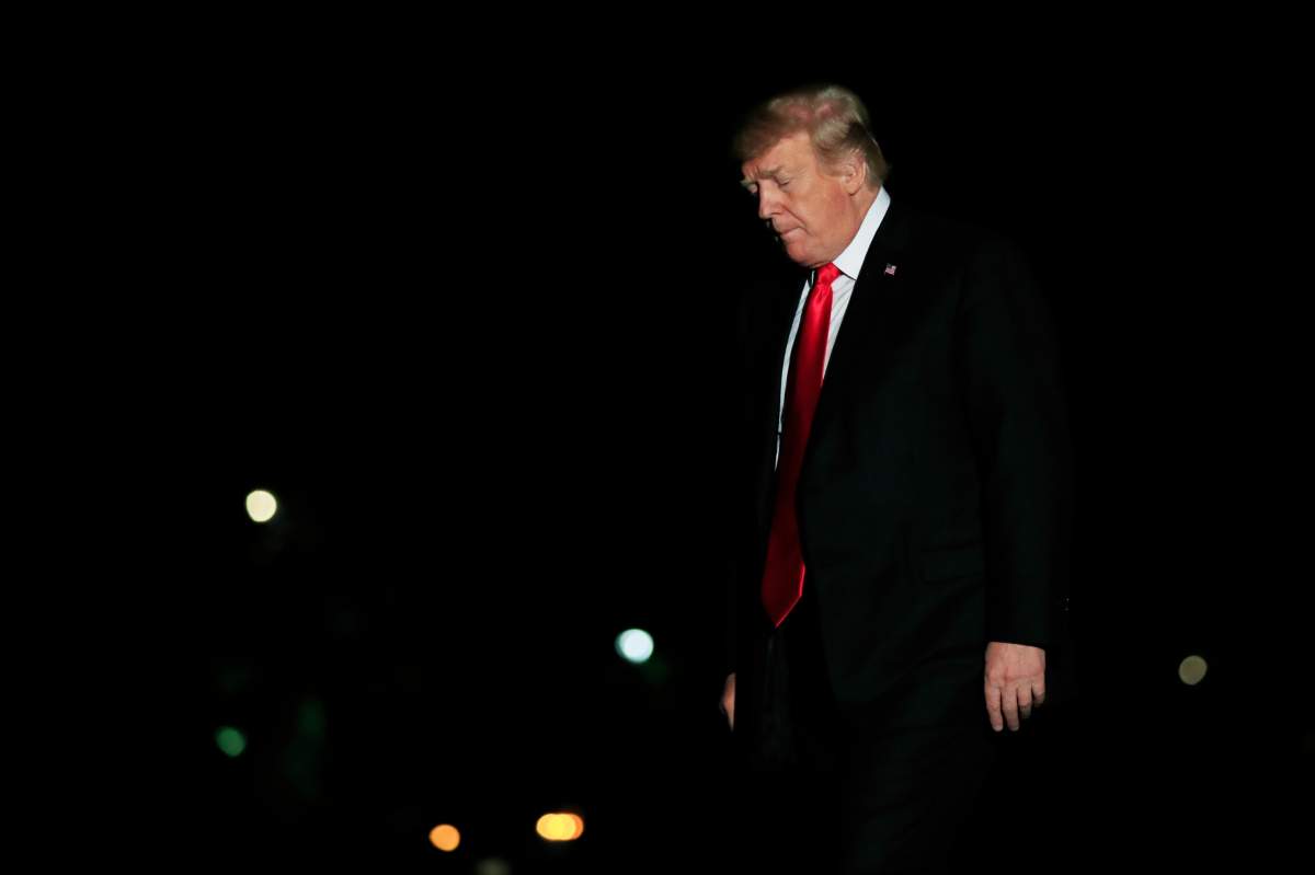 President Donald Trump walks on the South Lawn upon arrival at the White House in Washington, Wednesday, Oct. 10, 2018, from a trip to Omaha, Neb. 