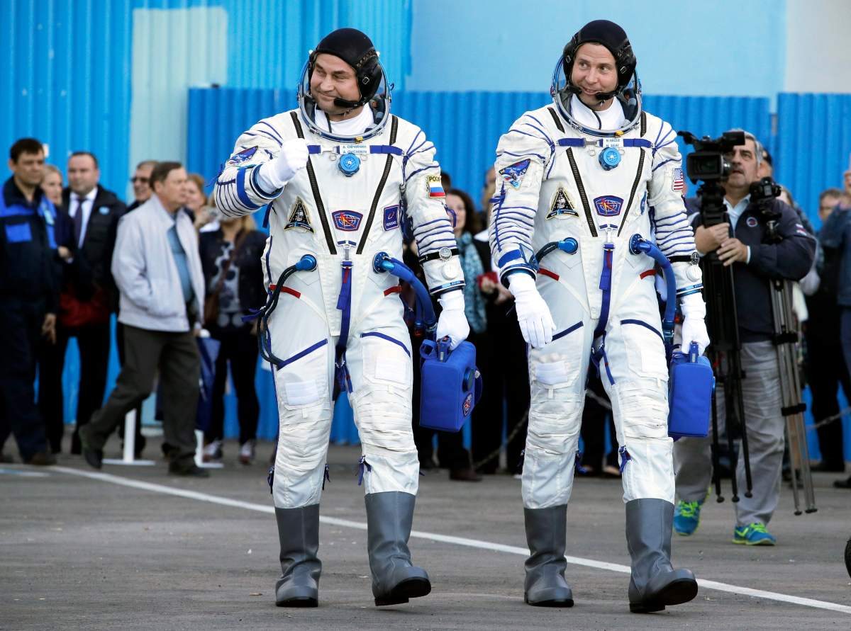 epa07084896 Crew members of expedition 57/58 to the International Space Station (ISS) Roscosmos cosmonaut Alexey Ovchinin (L) and NASA astronaut Nick Hague walk prior to the launch of the Soyuz MS-10 spacecraft at the Russian leased Baikonur cosmodrome in Kazakhstan, 11 October 2018.