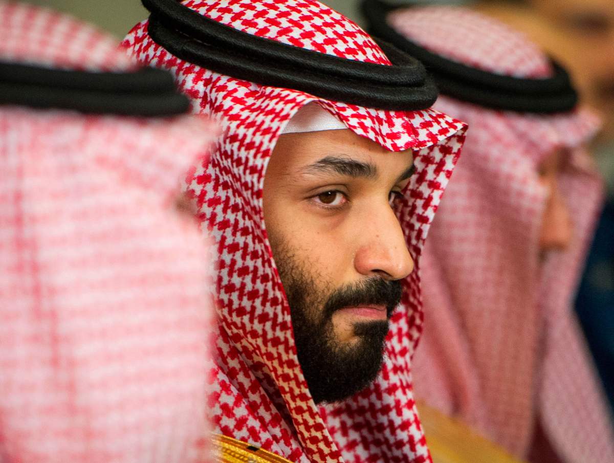 FILE – In this March 22, 2018, file photo, Saudi Crown Prince Mohammed bin Salman, center, meets with U.S. Defense Secretary Jim Mattis, not pictured, at the Pentagon in Washington.