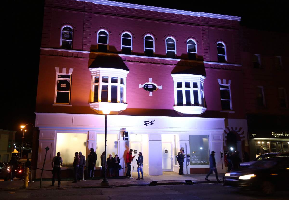 Local and International media set up as a small line starts to form in front of the Tweed store on Water Street in St. John’s N.L. on Tuesday, October 16, 2018.
