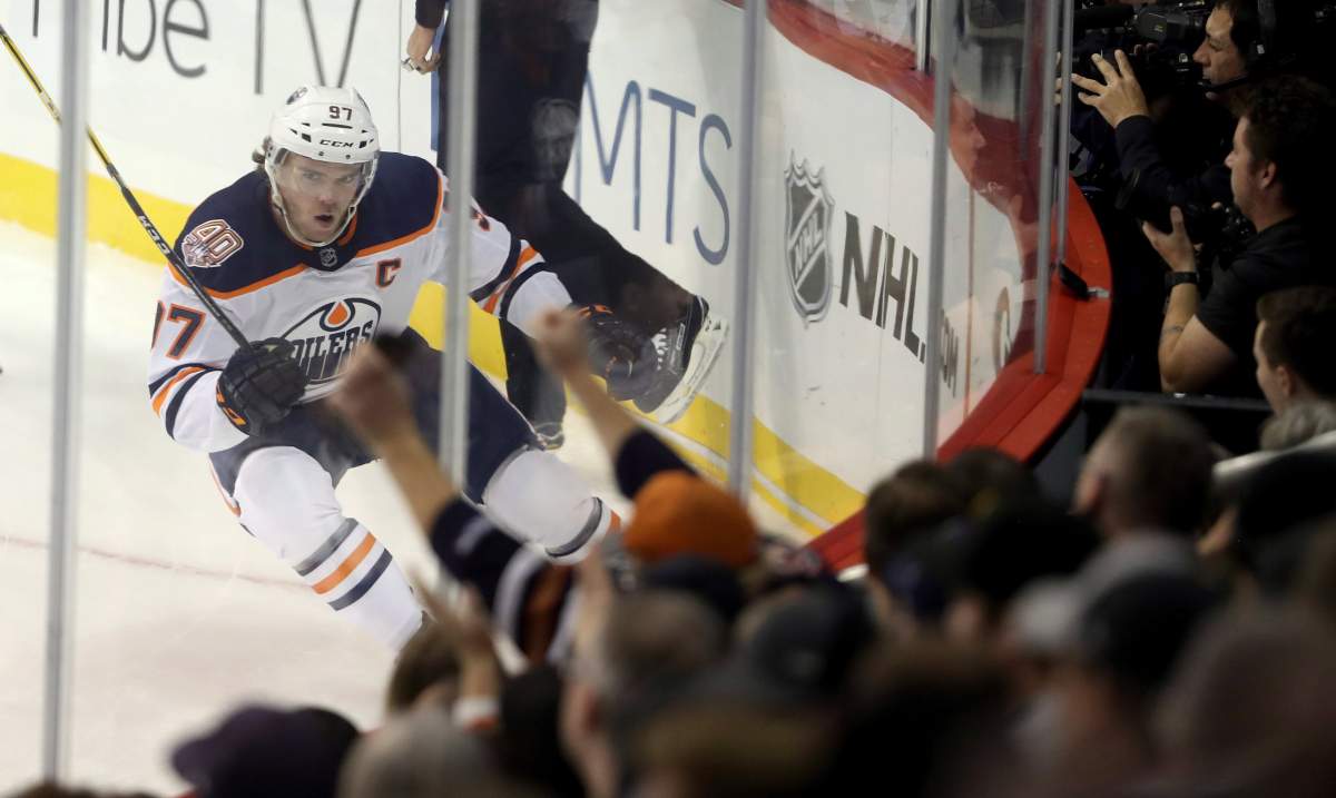 Edmonton Oilers' Connor McDavid (97) celebrates after scoring against the Winnipeg Jets during first period NHL hockey action in Winnipeg, Tuesday, October 16, 2018. 