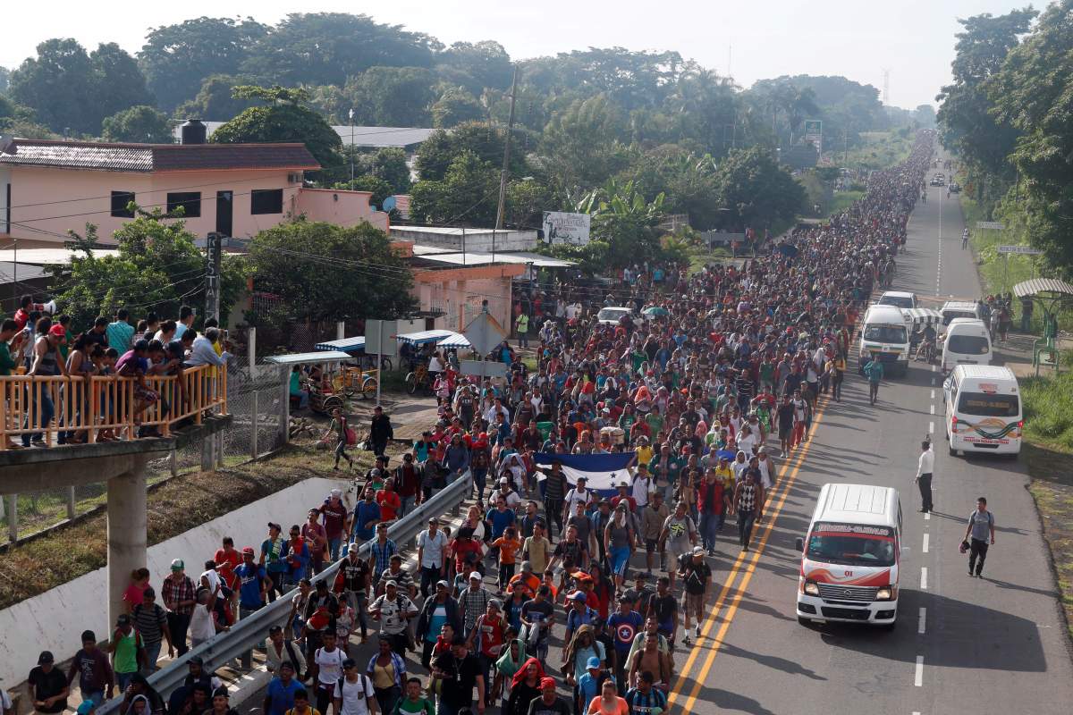 Central American migrants walking to the U.S. start their day departing Ciudad Hidalgo, Mexico, Sunday, Oct. 21, 2018.