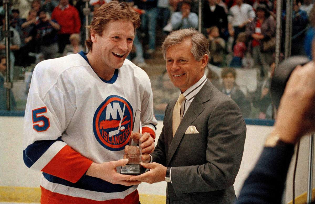 In this March 31, 1988, file photo, NHL President John Ziegler presents an award to New York Islanders defenseman Denis Potvin prior to the Islanders' game with the Washington Capitals at Nassau Coliseum in Uniondale, N.Y.  