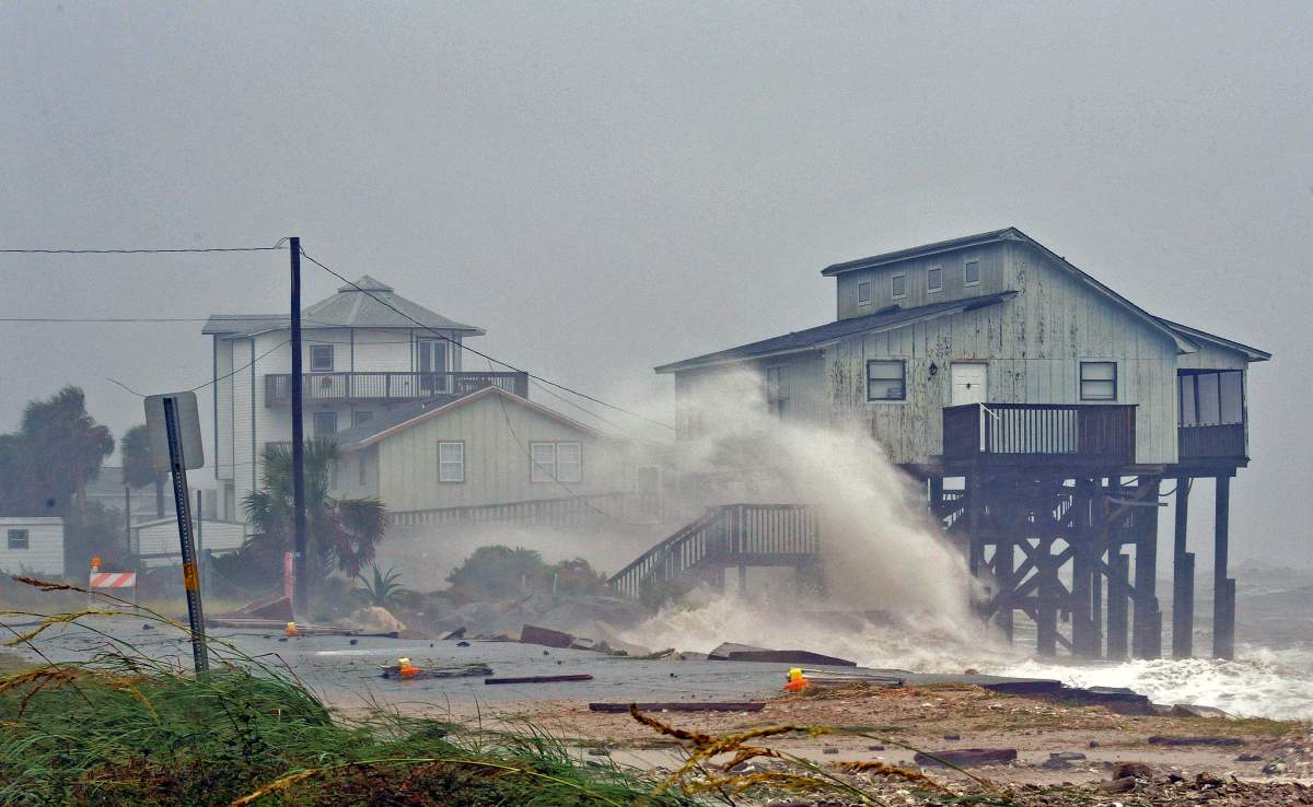 Waves crash on stilt houses along the shore due to Hurricane Michael at Alligator Point in Franklin County, Fla., on Oct. 10, 2018. REUTERS/Steve Nesius