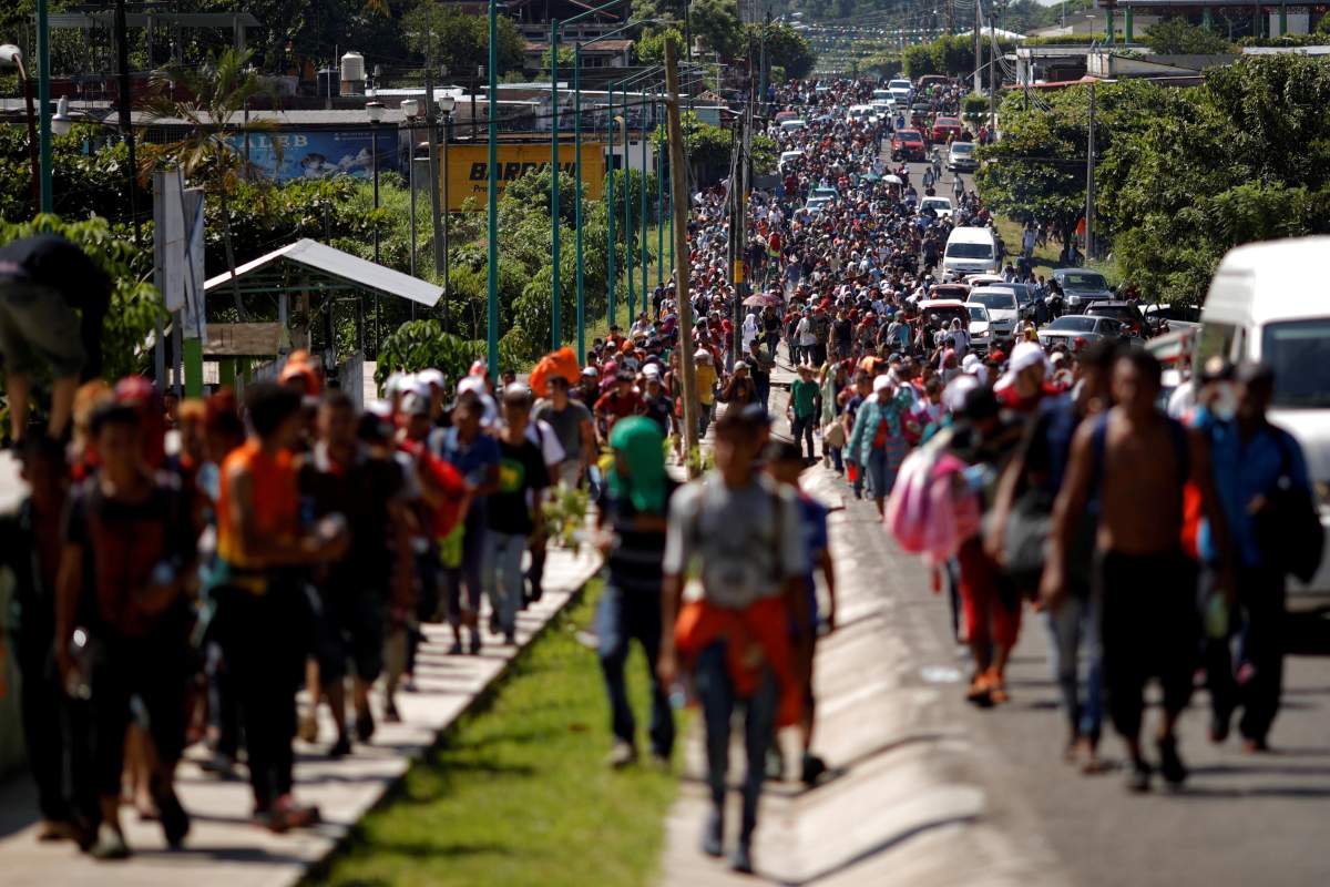 Central American migrants walk along the highway near the border with Guatemala, as they continue their journey trying to reach the U.S., in Tapachula, Mexico October 21, 2018.