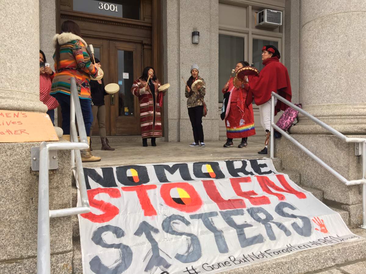 The protestors, chanting and drumming, unfurled a giant sign stating ‘No More Stolen Sisters.’