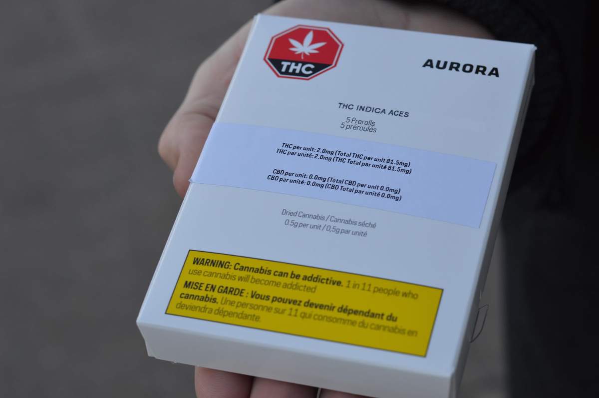Daniel Moore holds a package of pre-rolled cannabis cigarettes on Oct. 17, 2018. 