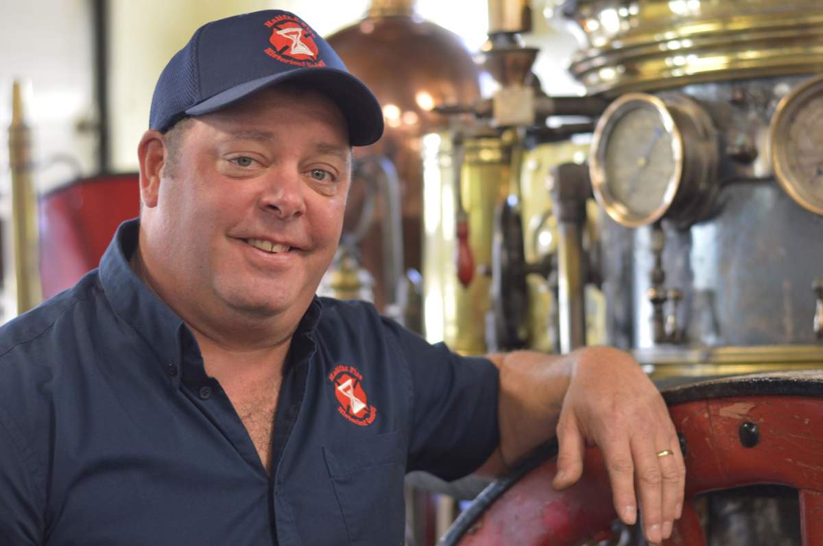 Jeff Brown of the Halifax Fire Histoical Society poses with the Lulan, a steamer built by the Manchester Locomotive Works in 1877, that will be temporarily stored with the Halifax Fire and Emergency department. 