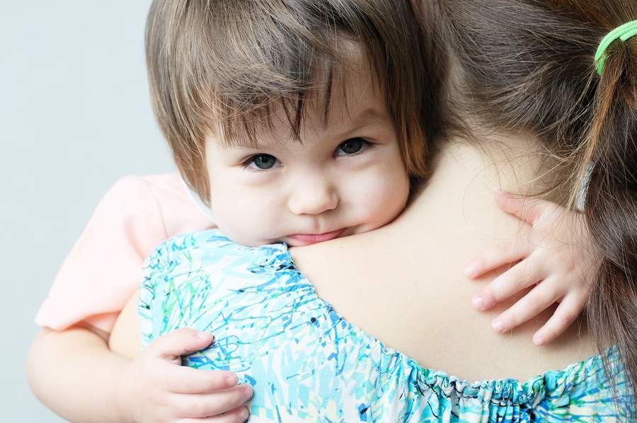 Child hugging parent