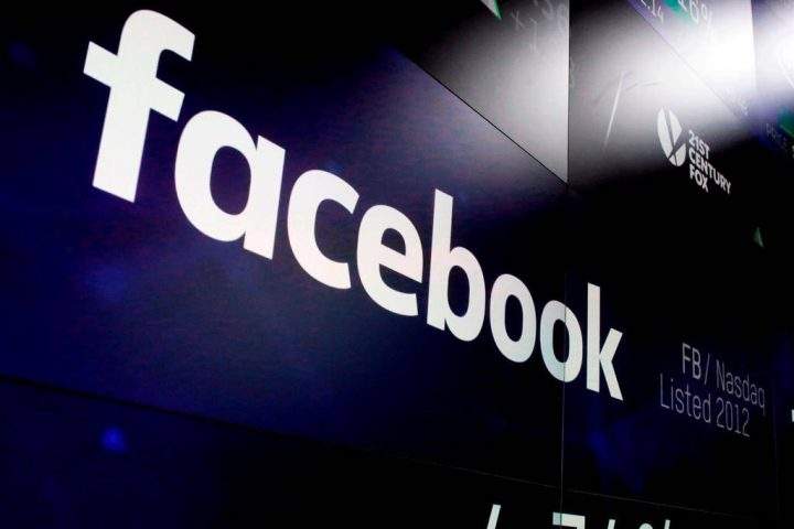 In this March 29, 2018, file photo, the logo for Facebook appears on screens at the Nasdaq MarketSite in New York's Times Square.