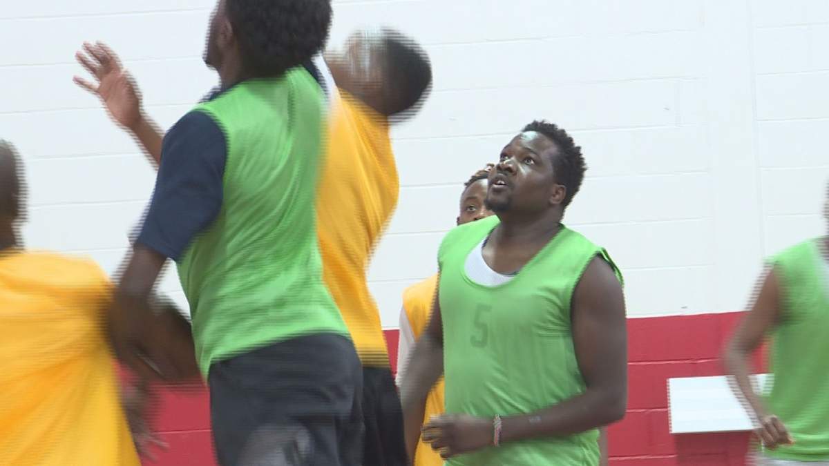 Abraham Kimutai (right) waits for a rebound.