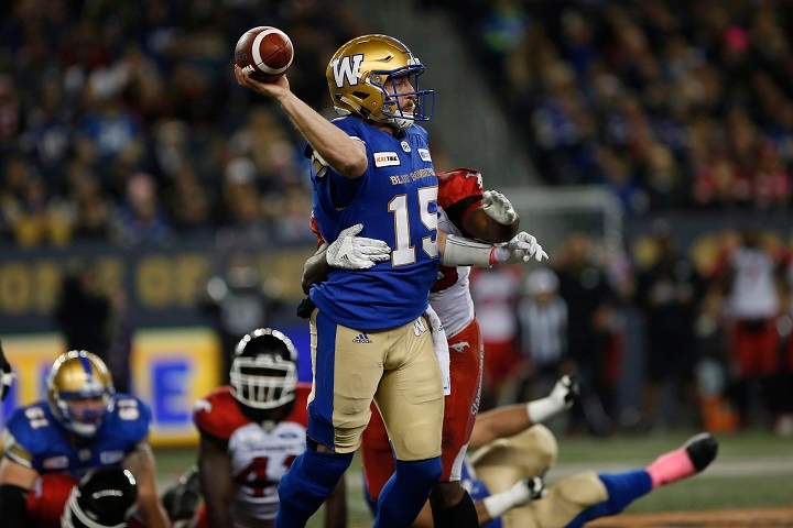 Winnipeg Blue Bombers quarterback Matt Nichols (15) gets the ball away during the first half of CFL action against the Calgary Stampeders, in Winnipeg, Friday, Oct. 26, 2018.