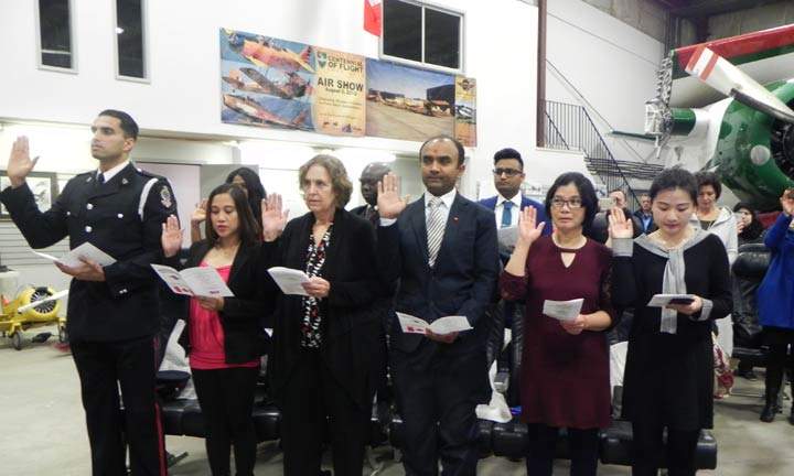 Twenty-five people become Canadian citizens at a special ceremony at the Saskatchewan Aviation Museum Tuesday.