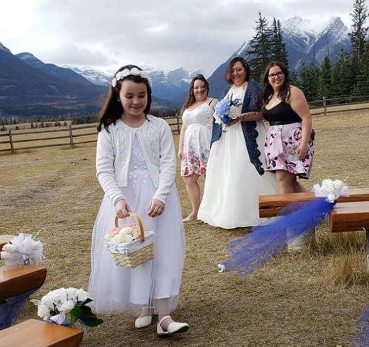 Flower girl Renee Morin walks down the aisle ahead of bride Bev Lesburg in Jasper on Sept. 29, 2018.