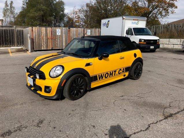 Yellow 2013 Mini Cooper also stolen, and sporting “World of Hot Tubs” website.