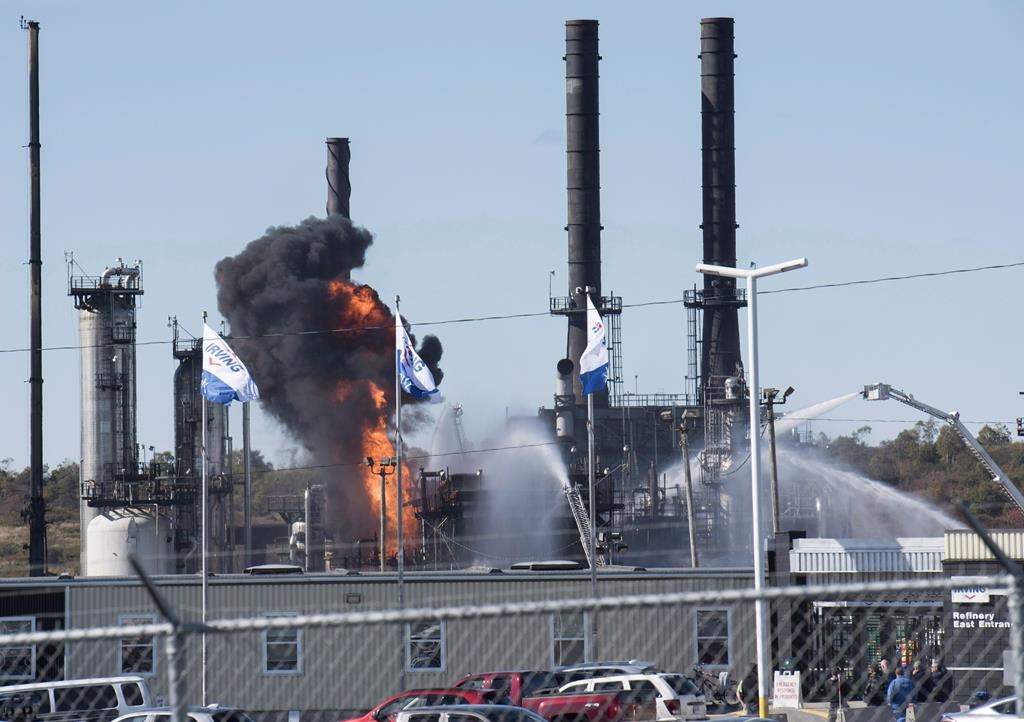 Flame and smoke erupts from the Irving Oil refinery in Saint John, N.B., on Oct. 8, 2018. THE CANADIAN PRESS/Stephen MacGillivray