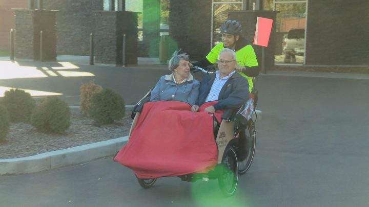Marlene and David Kimber riding in the trishaw bike with pilot, Mike Salud.