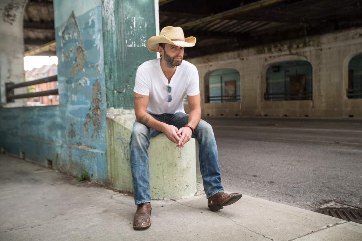 Dean Brody poses at a bridge on Queen St. East. Aug. 10, 2017.