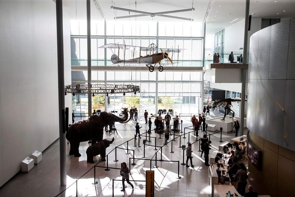 A crowd enters the Royal Alberta Museum on opening day, in Edmonton on Wednesday, Oct. 3, 2018. THE CANADIAN PRESS/Jason Franson.