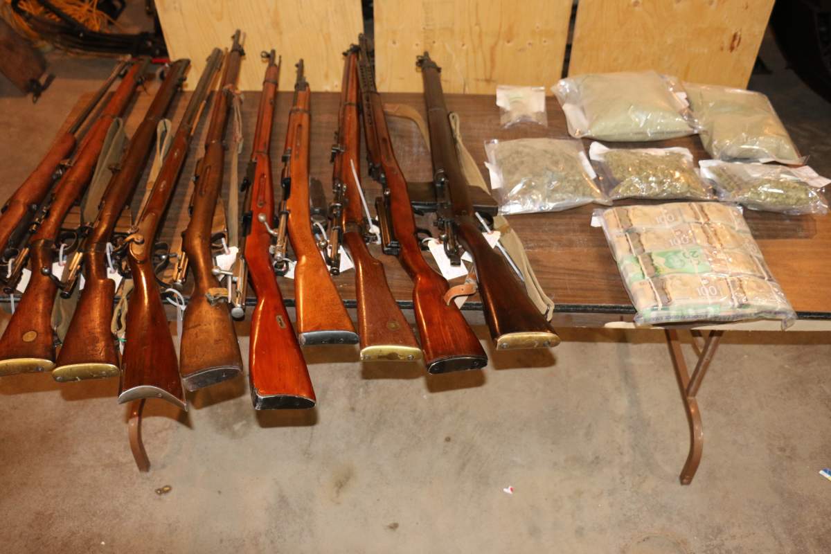 Flin Flon RCMP seized 12 long-barreled firearms along with cannabis and cash.
