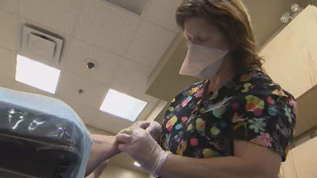 Volunteer health care professionals at the Saul Sair help people stay on their feet. 
