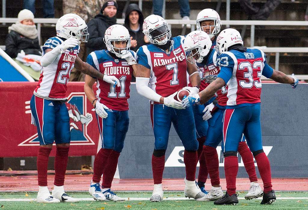 Montreal Alouettes' John Bowman (7) celebrates with teammates after scoring a touchdown during second half CFL football action against the Toronto Argonauts in Montreal, Sunday, Oct. 28, 2018.