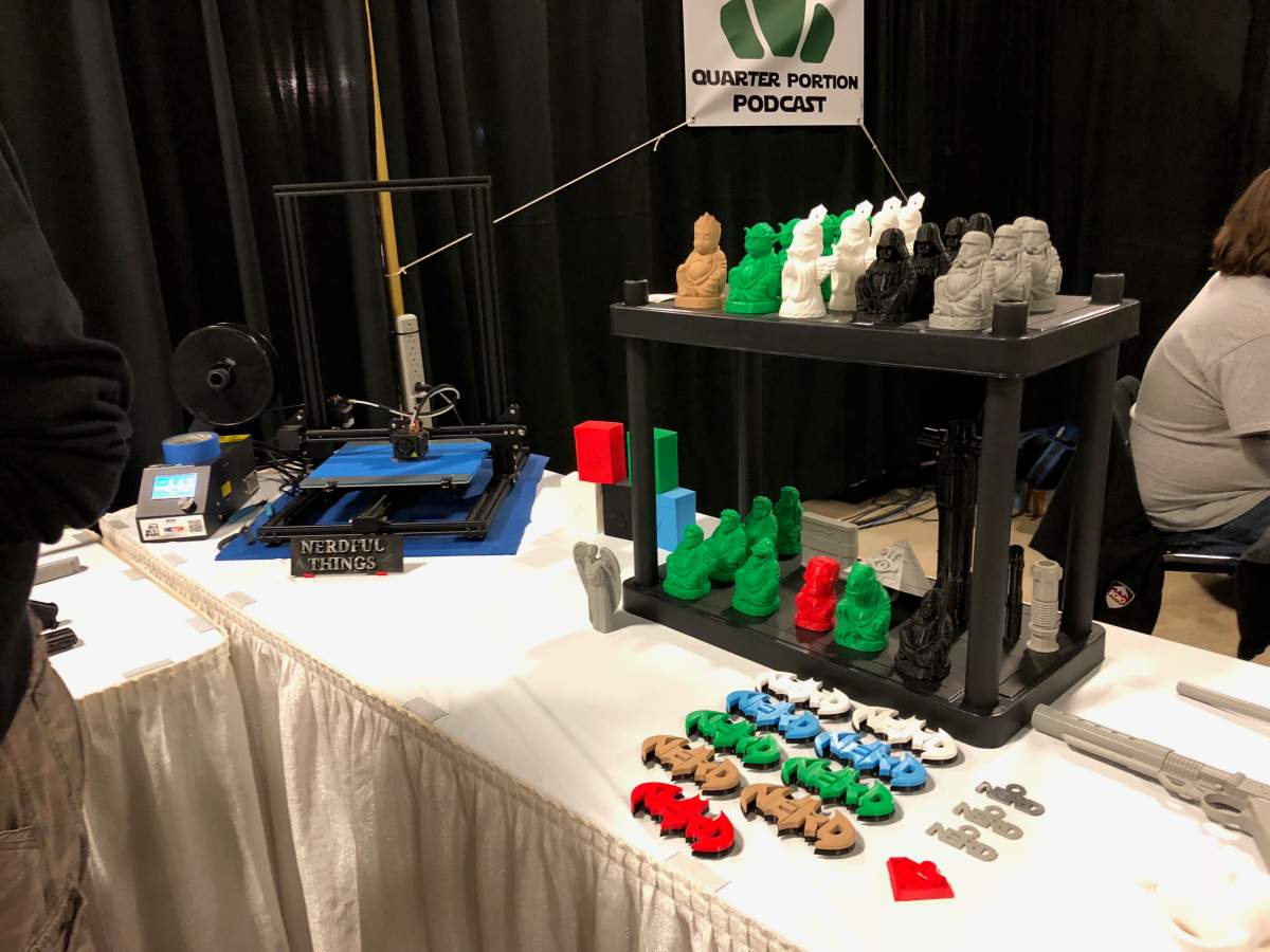 A number of Nerdful Things props sit beside the 3D printer responsible for their creation.
