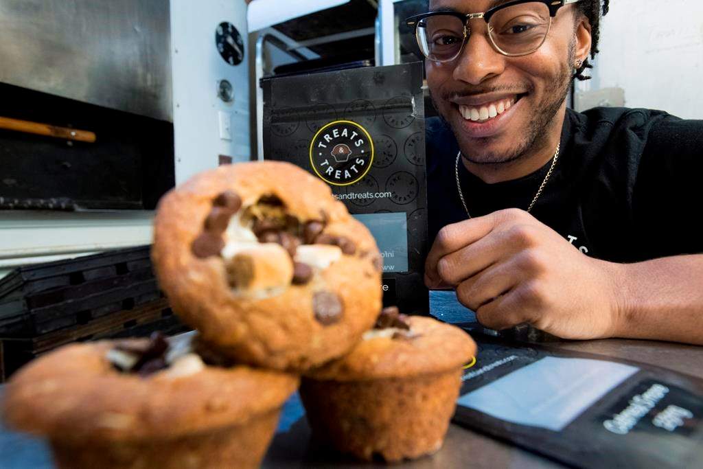 Yannick Craigwell shows off some of his edible marijuana baked treats in Vancouver, Wednesday, Oct. 3, 2018.