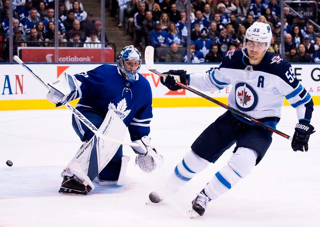 Winnipeg Jets centre Mark Scheifele (55) scores past Toronto Maple Leafs goaltender Frederik Andersen (31) during second period NHL hockey action in Toronto on Saturday, October 27, 2018.