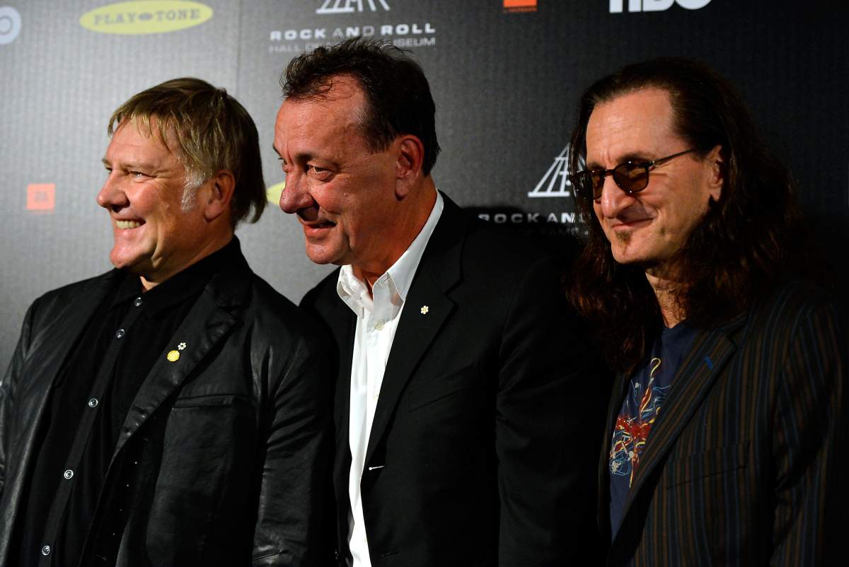 (L-R) Alex Lifeson, Neil Peart and Geddy Lee of Rush at the 28th Rock and Roll Hall of Fame Induction Ceremony at Nokia Theatre, on April 18, 2013, in L.A., Calif.