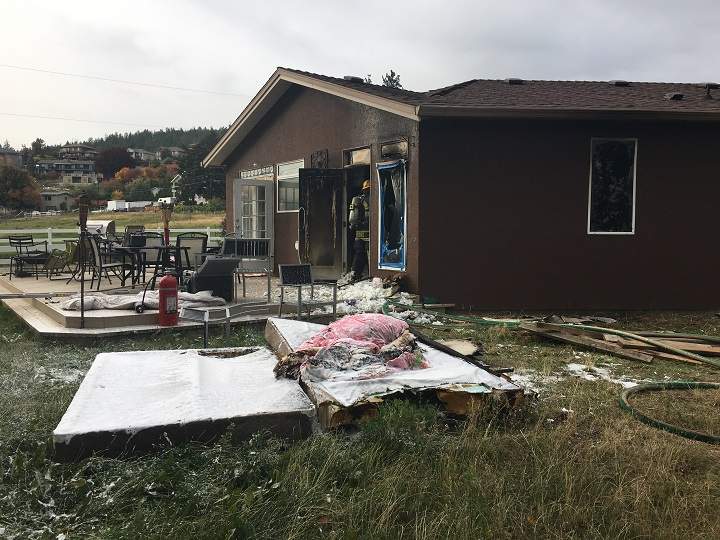 Emergency crews say the fire was contained to the back bedroom.
