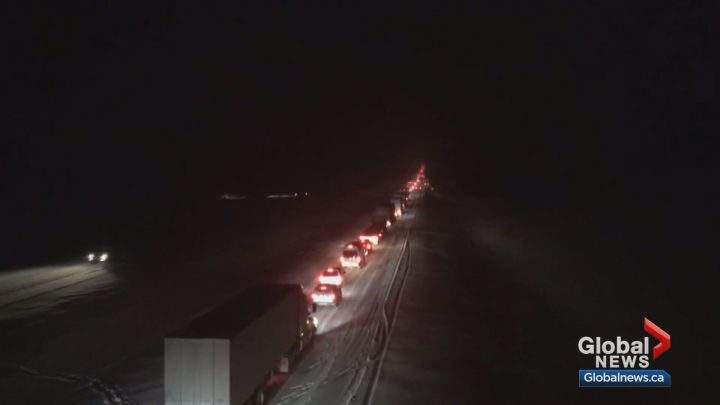 Drivers were stranded for up to 11 hours on Highway 1 near Canmore after a massive snowfall on Tuesday.