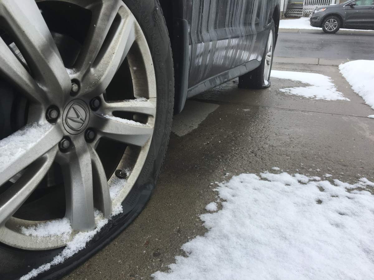 Both vehicles had tires slashed outside the Airdrie home.