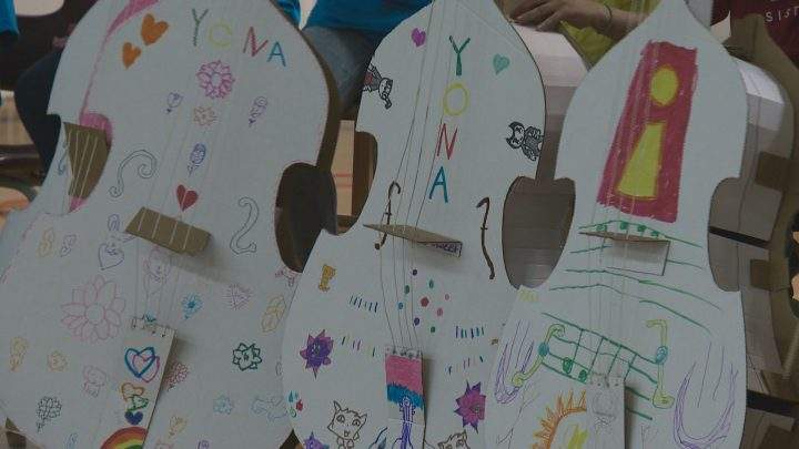 After learning music basics and proper instrument care with plastic and cardboard versions, 20 students graduated to the real thing on Tuesday.